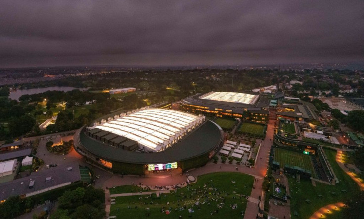 An aerial view shows No.1 Court (L) and Centre Court, after the roof was closed on both courts to allow play to continue, on the first day of the 2021 Wimbledon Championships at the The All England Tennis Club