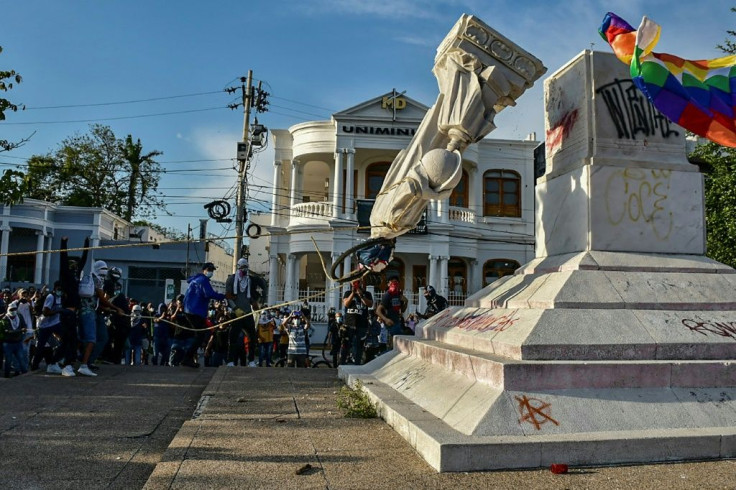 Demonstrators toppled a statue of the countryâs namesake, Christopher Columbus, in Barranquilla in the north