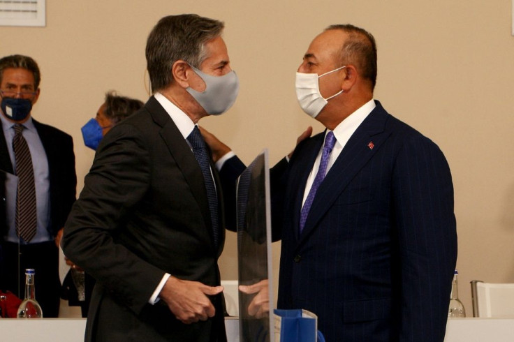 US Secretary of State Antony Blinken (l) greets Turkish Foreign minister Mevlut Cavusoglu ahead of the G20 meeting in Italy