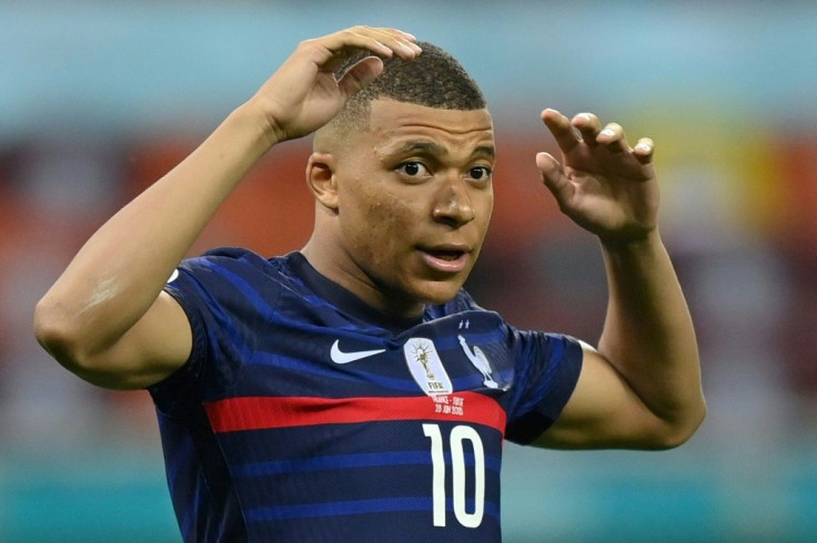 France forward Kylian Mbappe reacts after missing a penalty against Switzerland