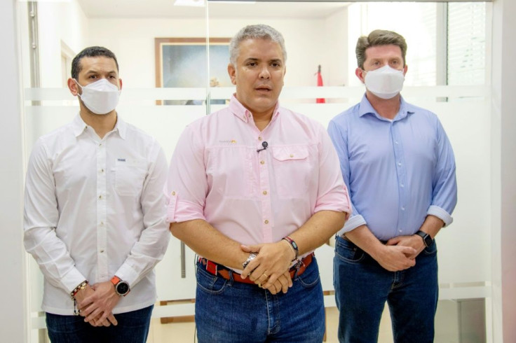 President Ivan Duque (C) with Interior Minister Daniel Palacios (L) and Defense Minister Diego Molano, in Cucuta, Colombia on June 25, 2021: Duque said Friday the helicopter he was flying in was hit by gunfire from ELN rebels