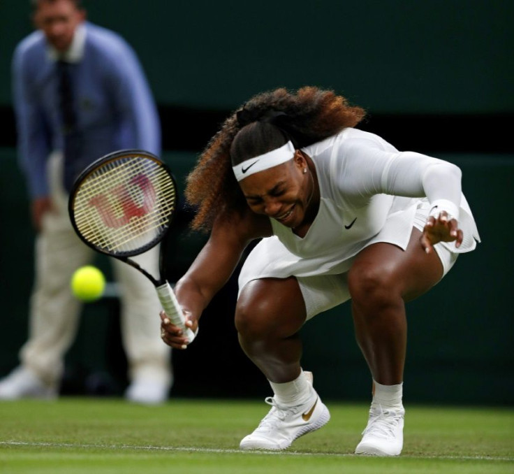 Serena Williams reacts as she pulls-up injured before withdrawing from her women's singles first round match against Aliaksandra Sasnovich