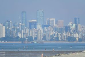 The city of Vancouver is seen through haze on a scorching hot day Tuesday