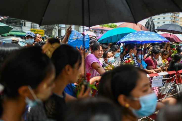 Relatives wait in front of Insein prison for the release of prisoners