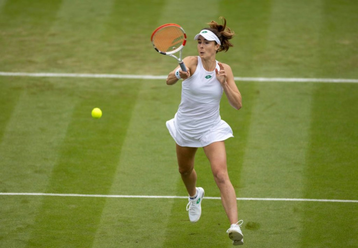 Winning run: France's Alize Cornet returns against Canada's Bianca Andreescu