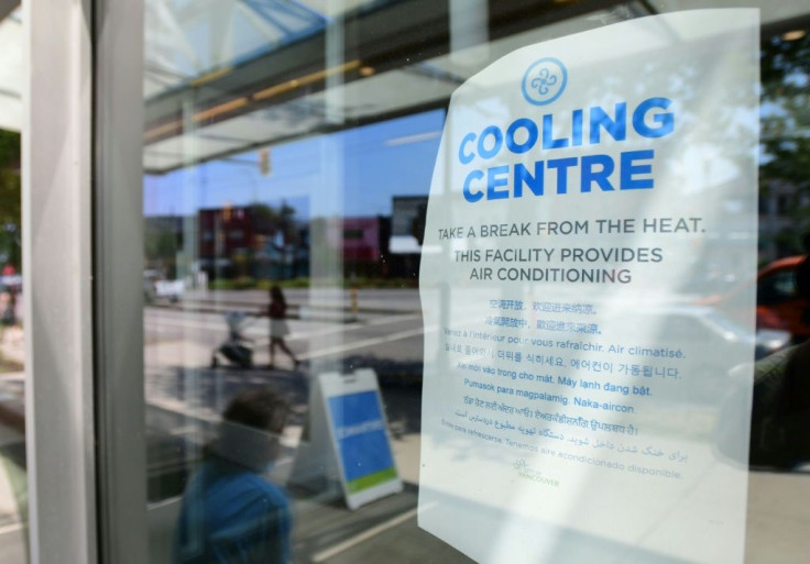A welcoming sign is seen on the door of the Hillcrest Community Centre, where people can cool off during the extreme hot weather in Vancouver, British Columbia, Canada