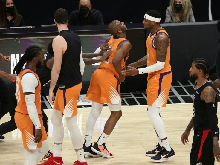 Chris Paul is shoved by Patrick Beverley as tempers flare in Phoenix's clash with the Los Angeles Clippers