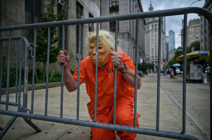 A Donald Trump impersonator poses for photos outside the Criminal Courts building and District Attorneys office in Manhattan