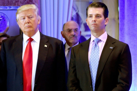 Then-president Donald Trump and his son Donald Jr. at Trump Tower in New York, with Trump Organization CFO Allen Weisselberg behind them, in January 2017