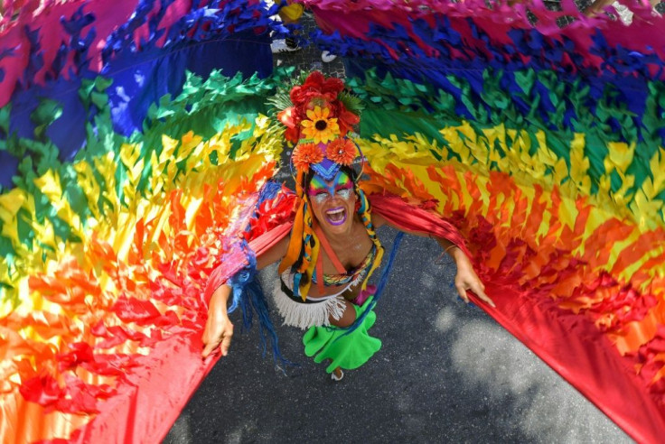 Stilt-walker Raquel Poti performs during the Gay Pride parade in Rio de Janeiro, Brazil, on September 30, 2018 For seven years, Poti, 37, performed as a stilts performer in carnival street parties and events and offered workshops in the gardens of the Mus