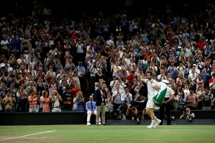 Crowd salute: Andy Murray waves to fans as he leaves Centre Court