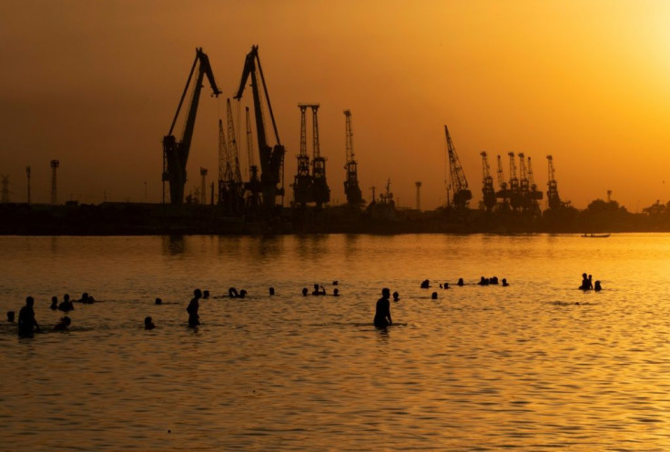 Iraqis swim in the Shatt Al-Arab river in the southern city of Basra on July 2 to cool off from an intense heatwave