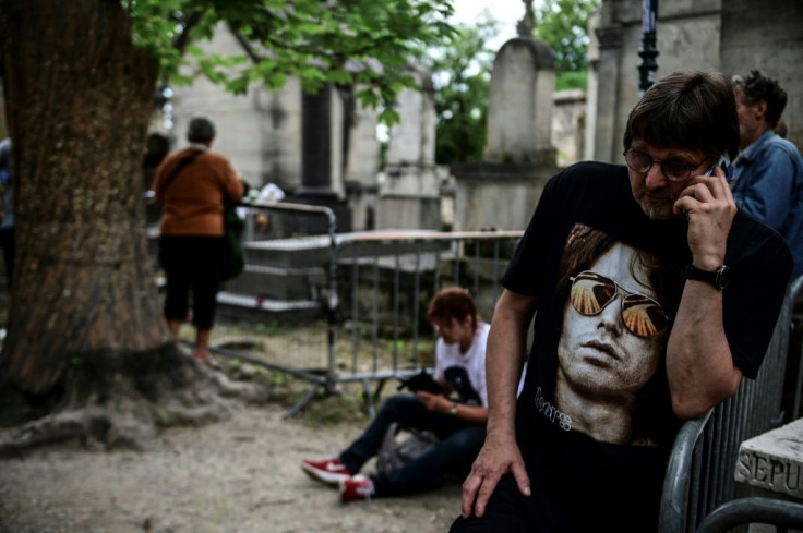 Fans of Jim Morrison gathered at his tomb to mark 50 years since his death in the French capital