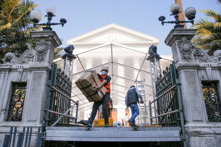 Workers in Chile prepare the National Congress headquarters before an elected assembly meets to draft the country's new Constitution