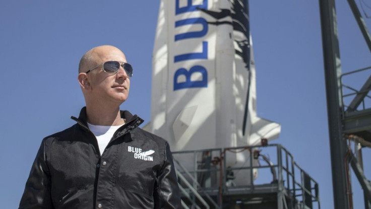 This April 24, 2015 handout photograph obtained courtesy of Blue Origin shows Jeff Bezos at New Shepard's West Texas launch facility before the rocket's maiden voyageThe two companies leading the pack in the pursuit of space tourism say they are just mo