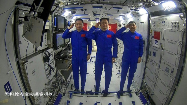 Chinese astronauts Tang Hongbo (L), Nie Haisheng (C) and Liu Boming (R) are the first crew on the nation's new space station