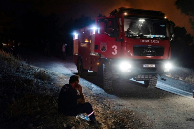 A firefighter in village of Vavatsinia in the Larnaca district of Cyprus, as efforts continue to control a giant wildfire raging during the night of July 3