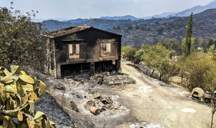 A charred house stands in the village of Ora in the Larnaca district of Cyprus on Sunday morning