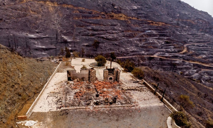 A drone picture taken on July 4, 2021 shows a destroyed house near Ora village on the southern slopes of the Troodos mountains close to Agioi Vavatsinias
