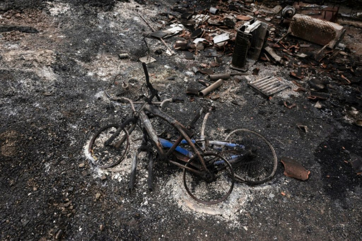 A picture taken on July 4, 2021 shows a pair of burnt bicycles near Ora village in Cyprus' Troodos mountain range