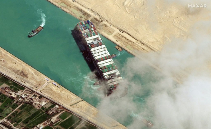 (FILES) In this file satellite imagery released by Maxar Technologies on March 29, 2021 the MV Ever Given container ship being pushed by tugboats in the Suez Canal. Egypt has signed a non-disclosure agreement with the Japanese owner of a megaship that blo