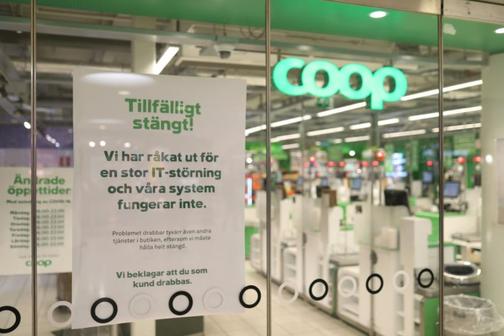 A Coop supermarket in Sweden has a sign reading "Temporarliy closed - We have an IT-disturbance and our systems are not functioning" posted in the window following a cyberattack that targeted a US provider of IT services