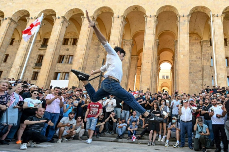 A protester dances at an anti-LGBTQ rally in Tbilisi on Monday