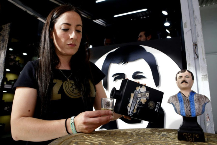 A model serves tequila of the brand "El Chapo 701" bearing the nickname of the jailed Mexican drug dealer Joaquin "El Chapo" Guzman,in Guadalajara, Mexico, on February 12, 2020