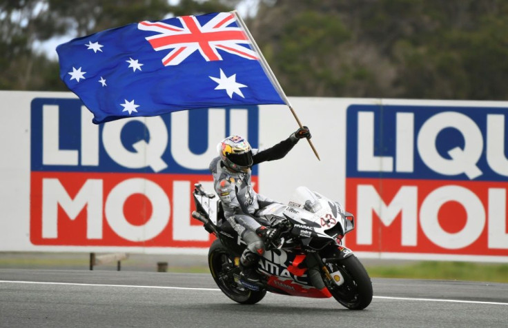 Jack Miller of Australia celebrates his third place in the MotoGP Australian motorcycle Grand Prix at Phillip Island. This year's race was cancelled on Wednesday