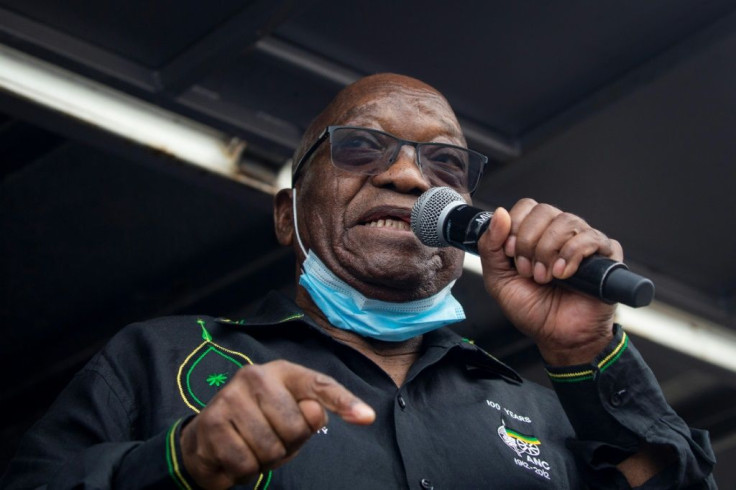 Zuma addressing his supporters camped outside his rural home on Sunday. He has mounted a last-ditch bid to head off a jail term for contempt of court