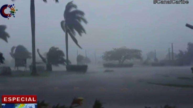 Tropical storm Elsa hits Cuba with drenching rain and strong wind as it makes its way north toward the Florida Keys.