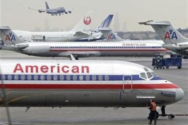 An American Airlines Boeing Super 80 (foreground) prepares to take off from Chicago's O'Hare International Airport January 9, 2006. 