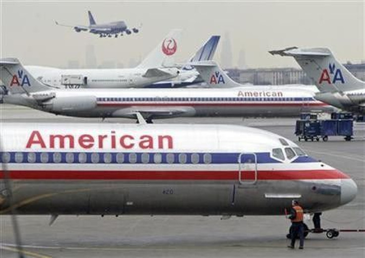 An American Airlines Boeing Super 80 (foreground) prepares to take off from Chicago's O'Hare International Airport January 9, 2006. 