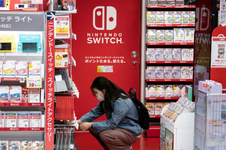 A customer browses the gaming section of Nintendo products in a shop in Tokyo on May 6, 2021