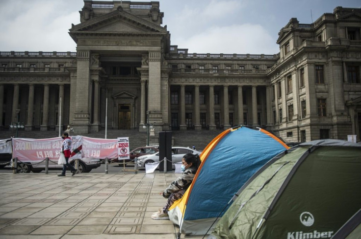 Supporters of Peruvian candidate for the Fuerza Popular party, Keiko Fujimori, camp outside the Justice Palace in Lima on July 06, 2021
