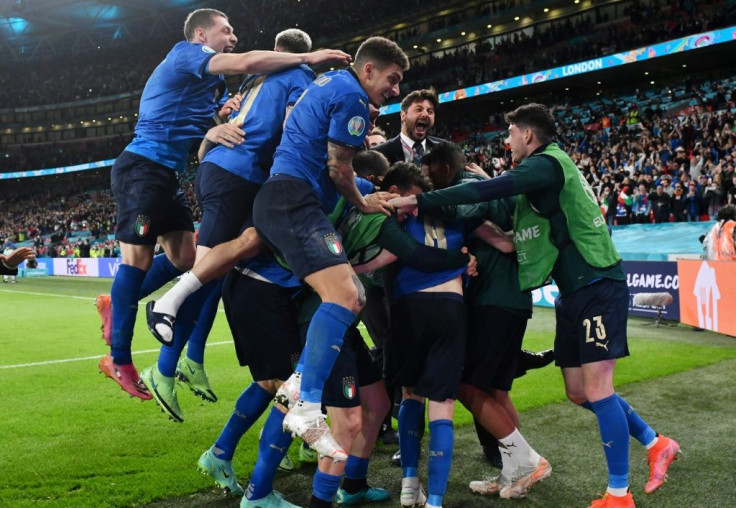 Italy players celebrate after beating Spain on penalties in their Euro 2020 semi-final at Wembley