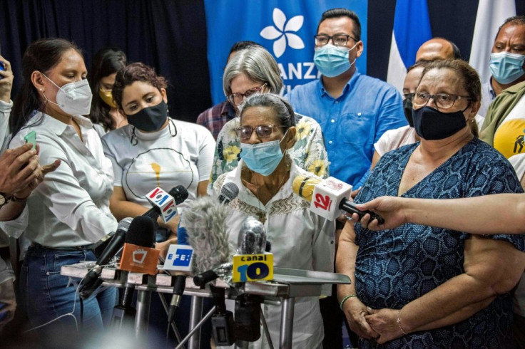 Lesbia Alfaro Silva (R) and Heidi Meza (C), mothers of detained student leaders Lesther Aleman and Max Jerez respectively, speak to the press in Managua on July 6, 2021