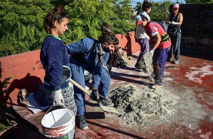 Female builders working on a house in Valentin Alsina in Buenos Aires province