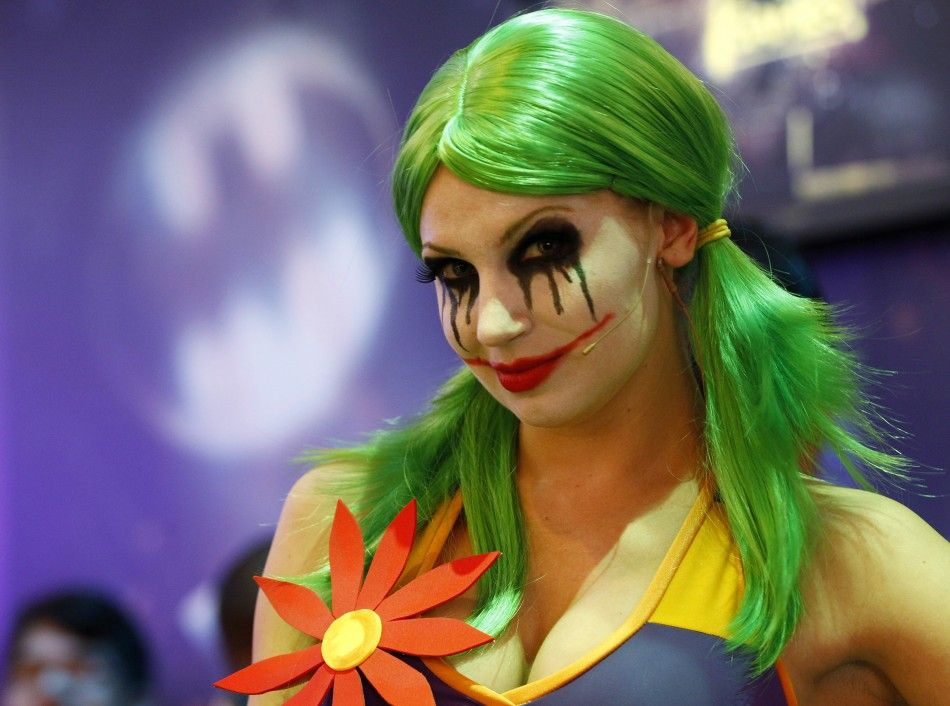 A woman dressed as quotThe Jokerquot smiles for the camera while promoting Warner Bros. Interactive Entertainment, Inc.039s new video game quotGotham City Impostorsquot during the Electronic Entertainment Expo or E3 in Los Angeles