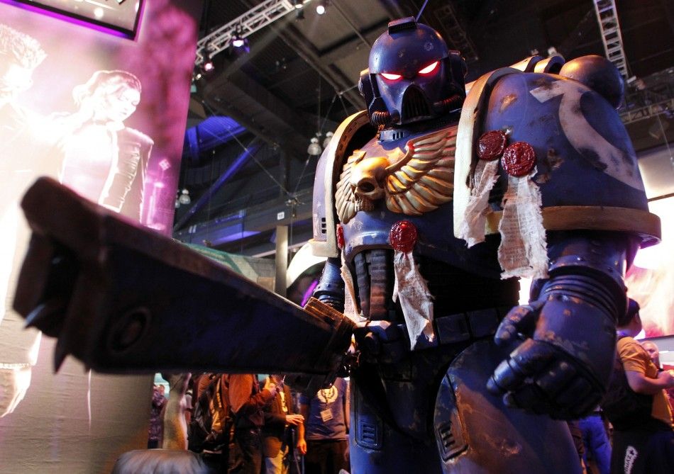 A character from the video game quotWarhammer 40,000 Space Marinequot developed by Relic Entertainment and published by THQ poses during the Electronic Entertainment Expo or E3 in Los Angeles