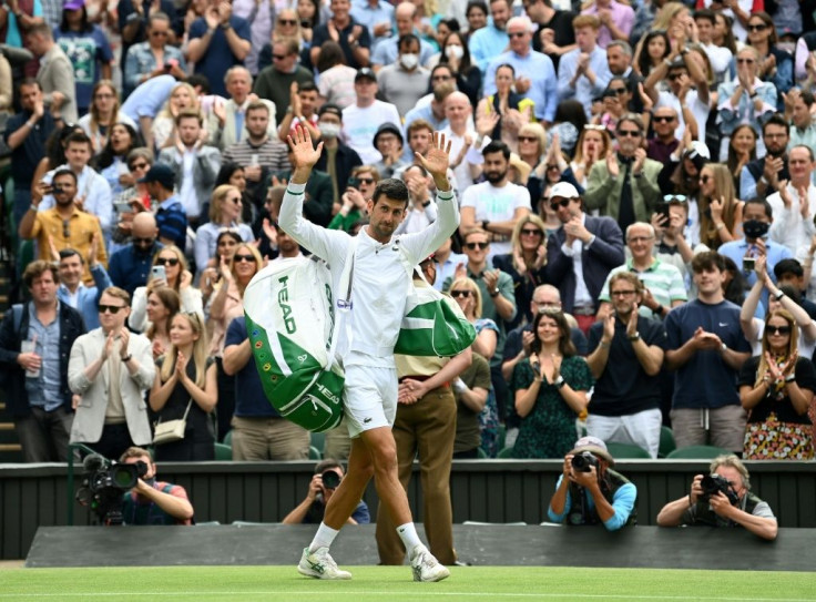 Crowd salute: Novak Djokovic leaves the court after defeating Hungary's Marton Fucsovics