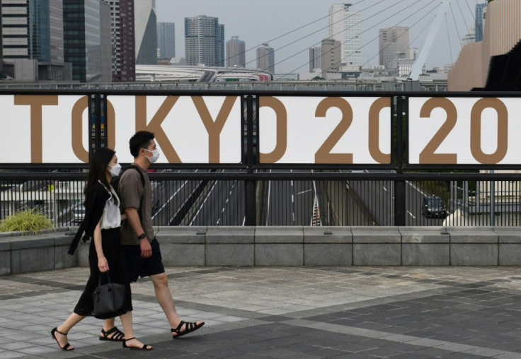 Olympic organisers are scrambling to make a final call on how many spectators, if any, can be in the stands