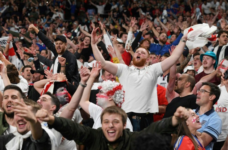 Passion play: Supporters celebrate after England beat Denmark to reach their first final since winning the 1966 World Cup, also at Wembley