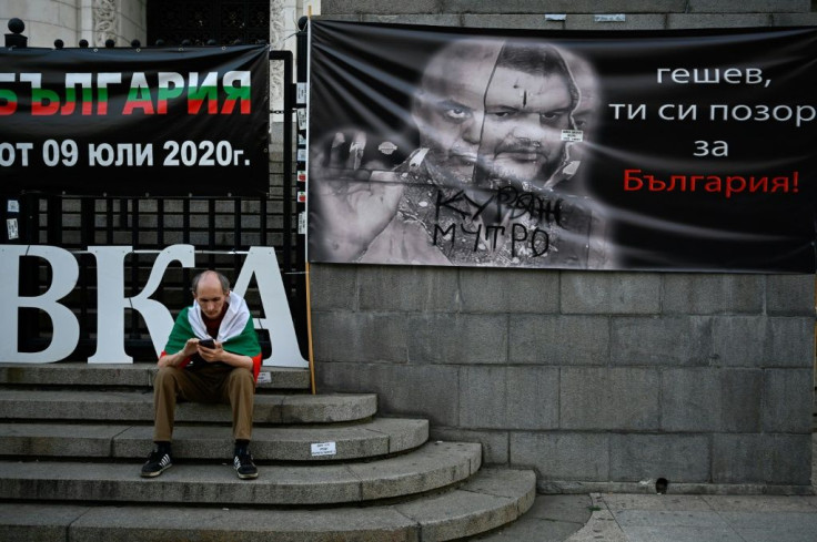 A poster showing Bulgaria's chief prosecutor Ivan Geshev and former MP Delyan Peevski highlights the focus on corruption in the upcoming snap election