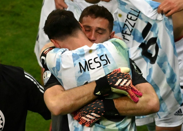 Lionel Messi celebrates with goalkeeeper Emiliano Martinez whose three penalty shoot-out saves sent Argentina into the Copa America final