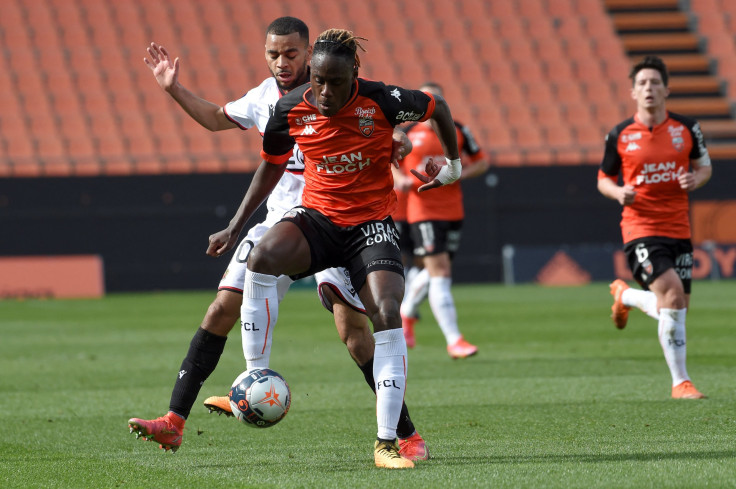 Nice's French forward Alexis Claude-Maurice (L) vies with Lorient's British defender Trevoh Chabolah (r) 