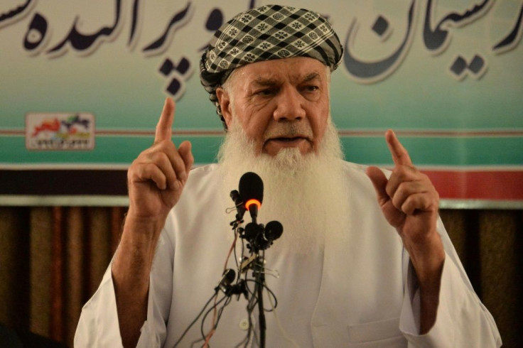 Afghan warlord Ismail Khan addresses a news conference, where he urged government troops to show courage against the Taliban
