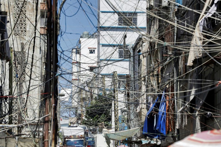 This picture from June 23, 2021 shows a web of raised power lines in a suburb of Lebanon's capital Beirut