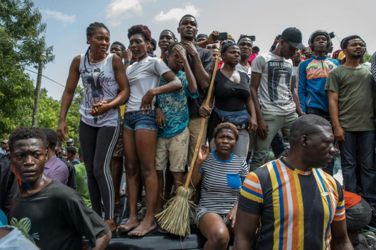 A crowd gathered outside the Petionville police station wehre suspects in the assassination of the Haitian president are being held