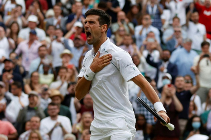 Roar of victory: Novak Djokovic celebrates his win against Canada's Denis Shapovalov